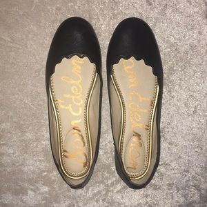 Sam Edelman flats with scalloped edges.